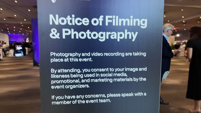 An ETHConf sign headed Notice of Filming and Photography: photography and video recording are taking place at this event, and attending means consenting to your image being used by the event organizers.